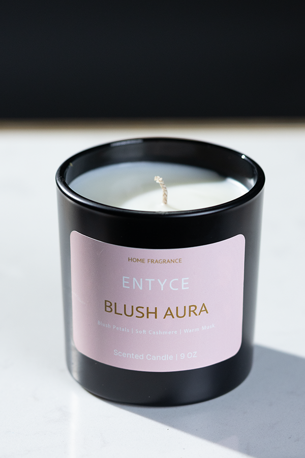 Open Blush Aura scented candle showing white wax and wick