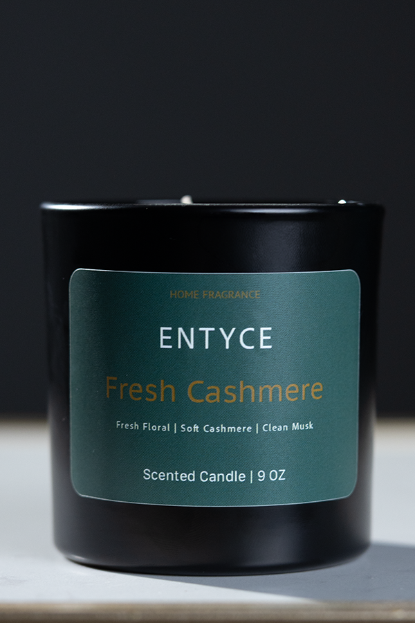 Fresh Cashmere 9 oz scented candle in a black glass jar